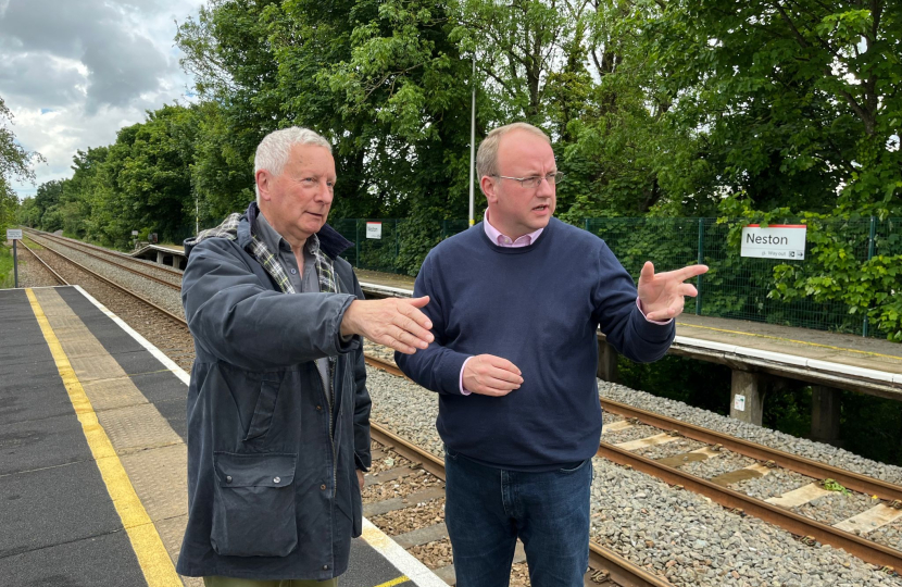 Simon Eardley with a man at Neston train station