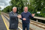 Simon Eardley with a man at Neston train station